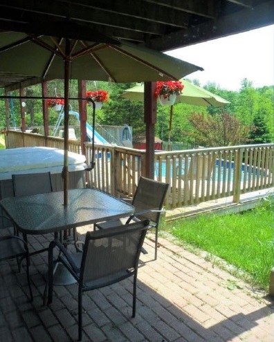 lower patio and pool area at 42815 Beck Line, St Thomas, Ontario