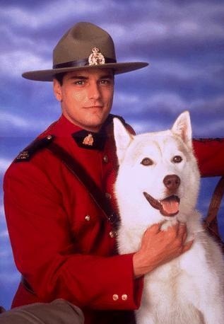 Paul Gross as Mountie Benton Fraser with dog Diefenbaker