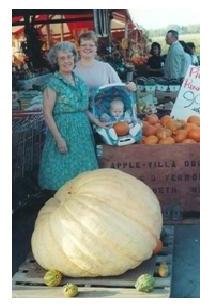 giant pumpkin in Fall in Ontario, two women and baby