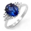 White Gold ring has large blue Sapphire,  12 small Diamonds, size 7, retail value $530.00, our price $175.00