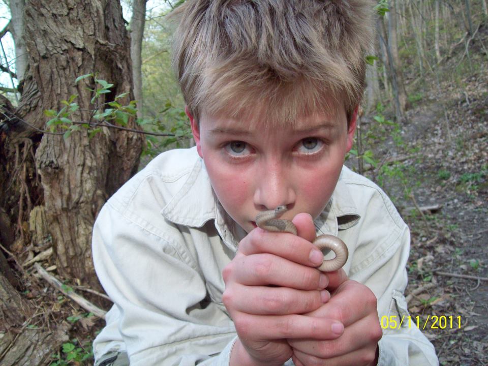 Aaron Blanshard, photographer, with small garter snake