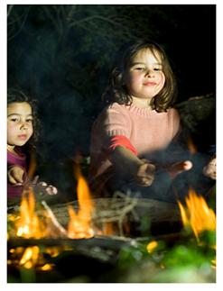 Children around the campfire Dalewood Conservation Area, St Thomas