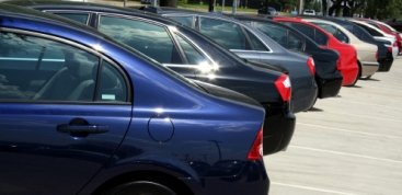 car rental vehicles waiting for drivers in parking area