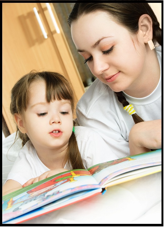 homeschooling mother and daughter reading together