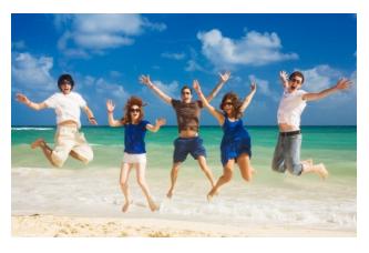 Five young people enjoying the beach