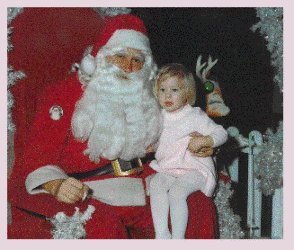 Santa Claus and little girl in pink dress, Christmas in Canada